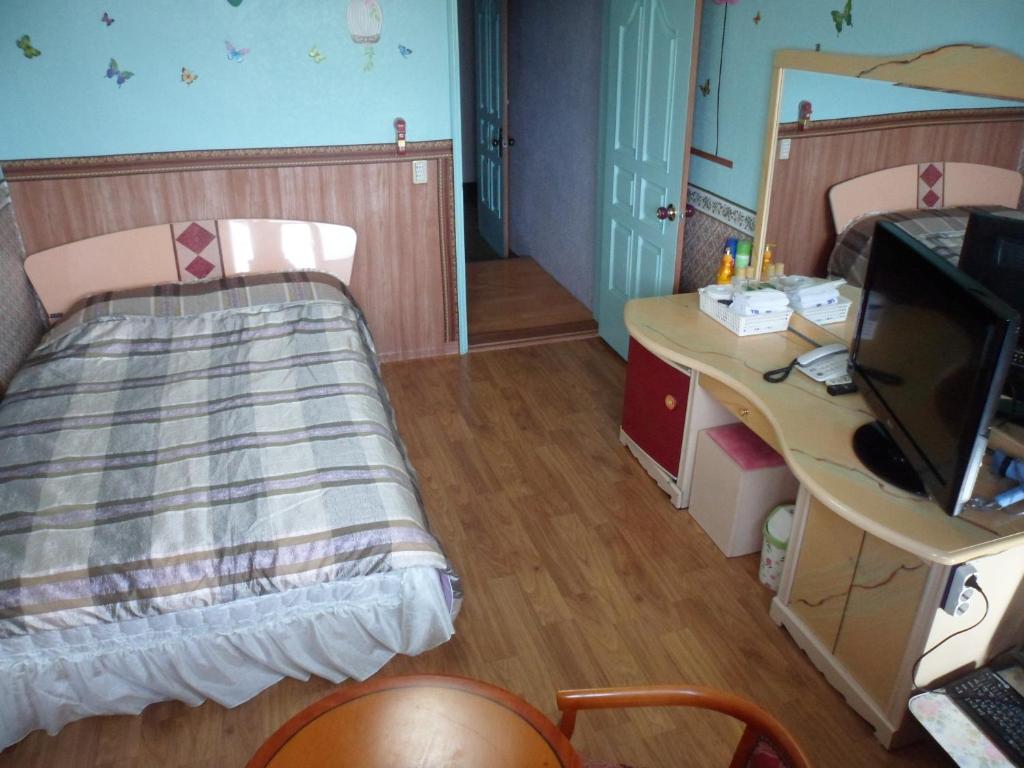 Postel nebo postele na pokoji v ubytování Gyerim Motel