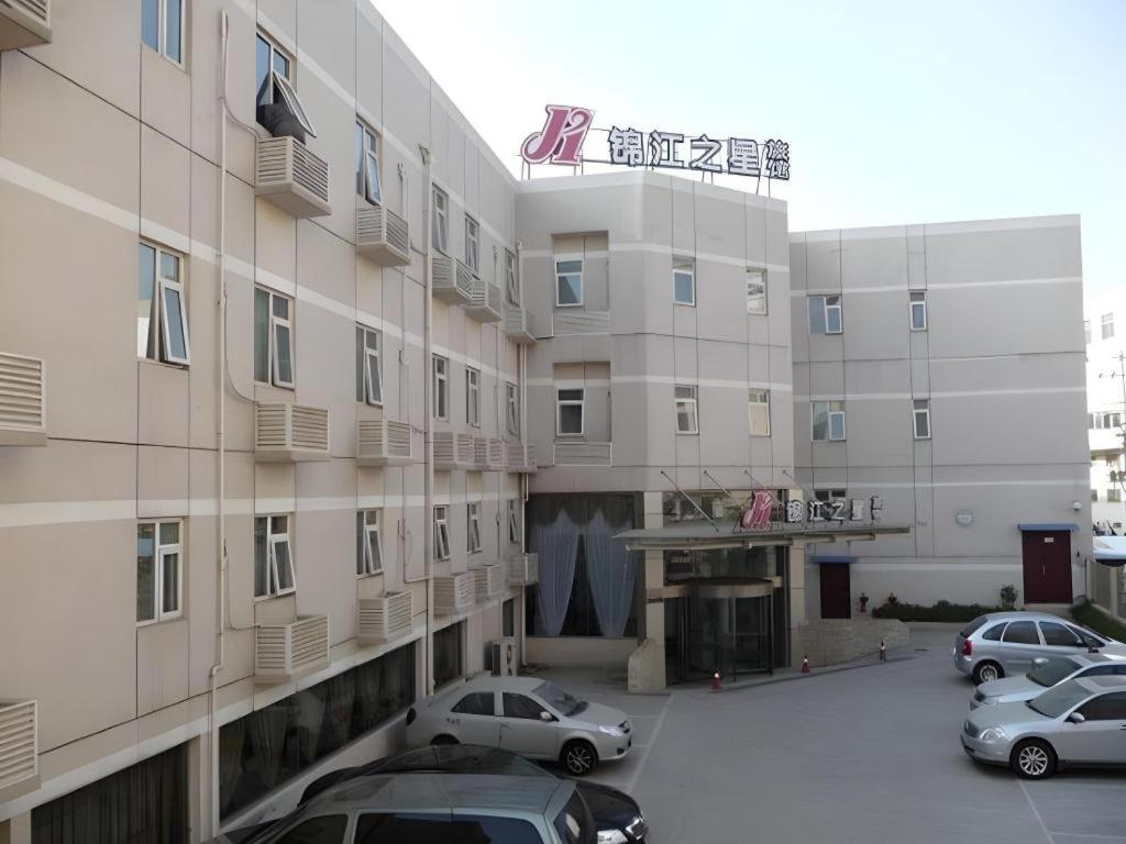 a parking lot in front of a building at Jinjiang Inn Nanjing South Railway Station in Nanjing