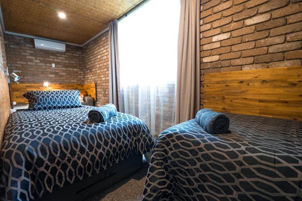 Postel nebo postele na pokoji v ubytování Farnham Court Motel and Restaurant