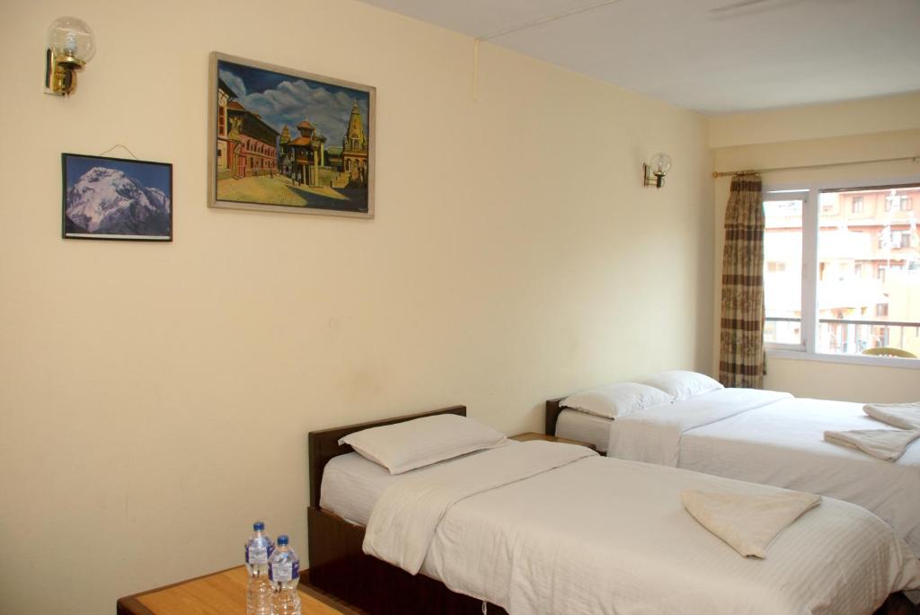 Postel nebo postele na pokoji v ubytování Kathmandu Madhuban Guest House