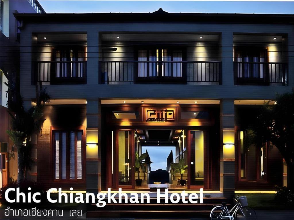 a building with a sign that reads chikhan man hotel at Chic Chiangkhan Hotel in Chiang Khan