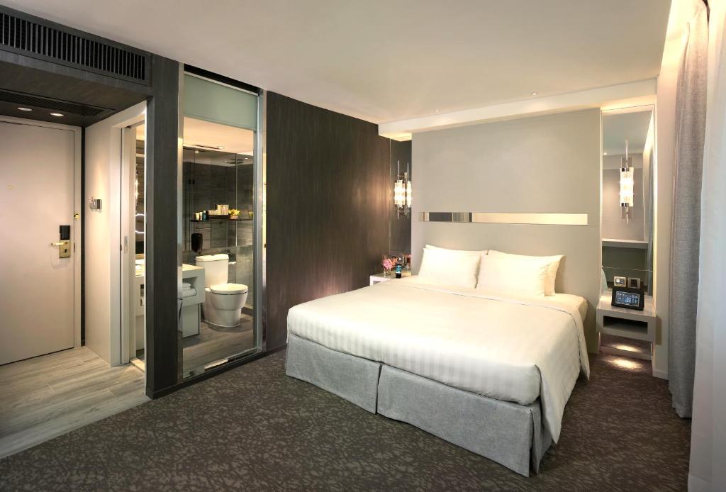 Postel nebo postele na pokoji v ubytování Nathan Hotel