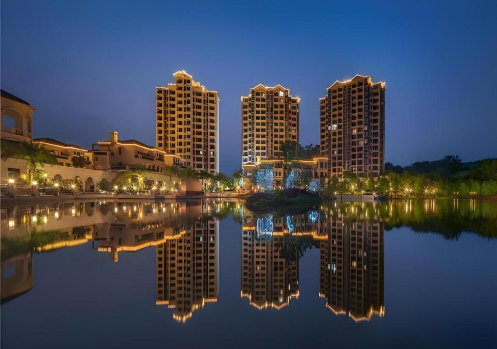 a city with tall buildings and a body of water at Poltton International Service Apartment Fujian Changtai Mayangxi in Zhangzhou