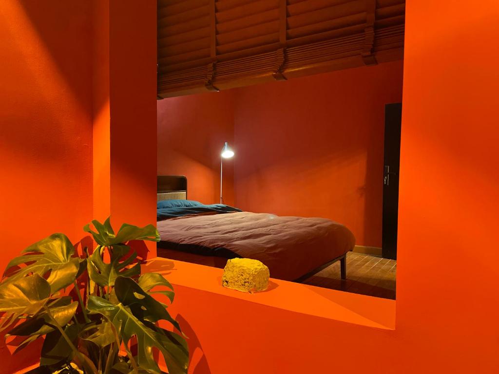 a bedroom with a bed and a mirror at The house where time is wasted under the road in Chongqing