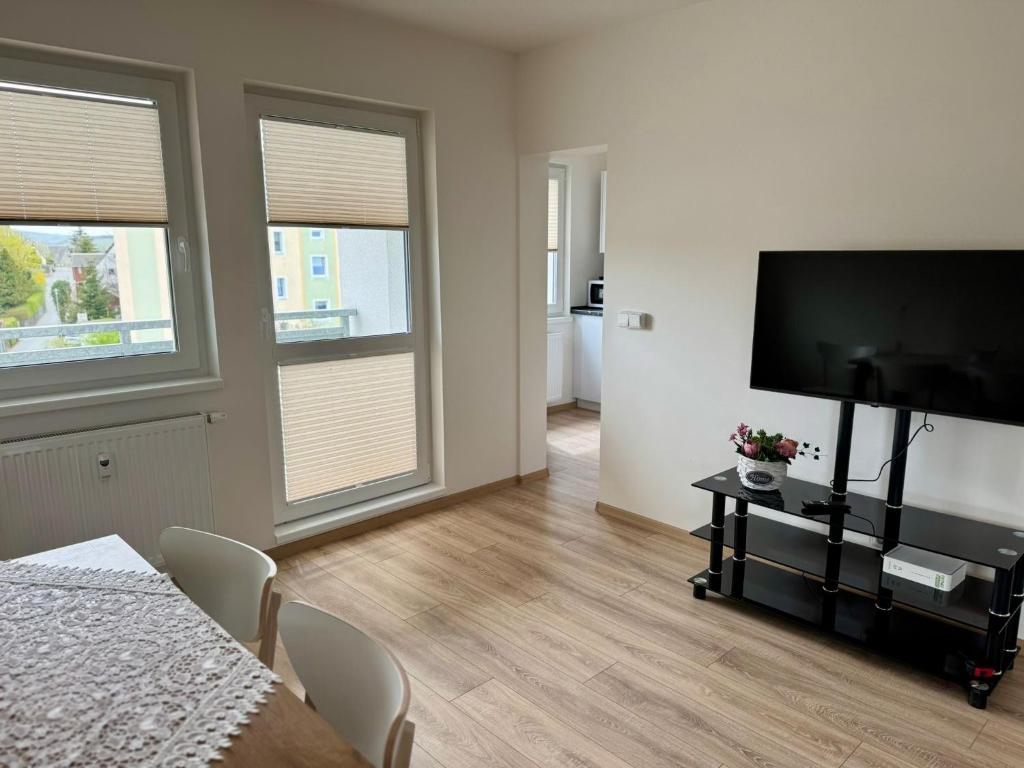 TV a/nebo společenská místnost v ubytování Apartmány Wolkenstein