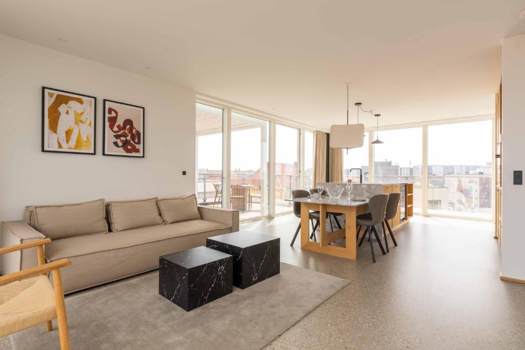 a living room with a couch and a table at Nørrebrogade 209 in Copenhagen