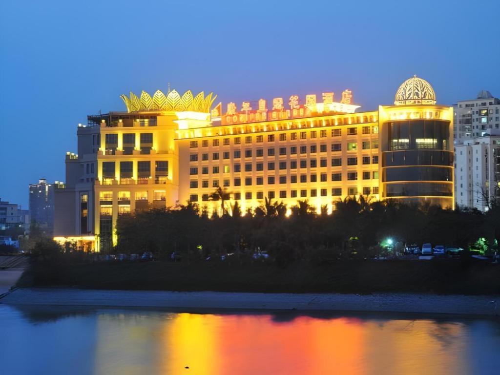 a large yellow building with a pyramid on top of it at Haikou Conifer Garden Hotel in Haikou