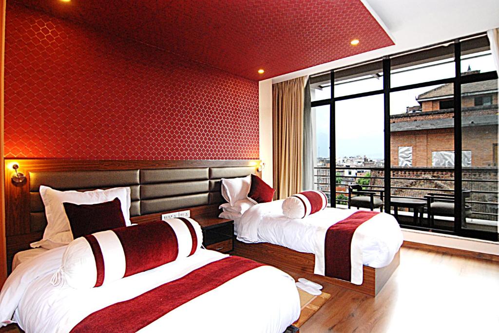Letto o letti in una camera di The Address Kathmandu Hotel