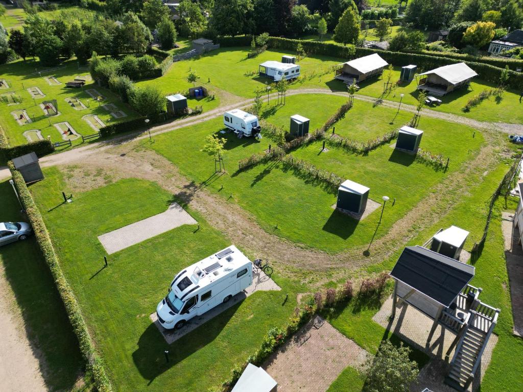 an aerial view of an rv park with tents at Empty camping spot for your tent, caravan and camper in Swalmen