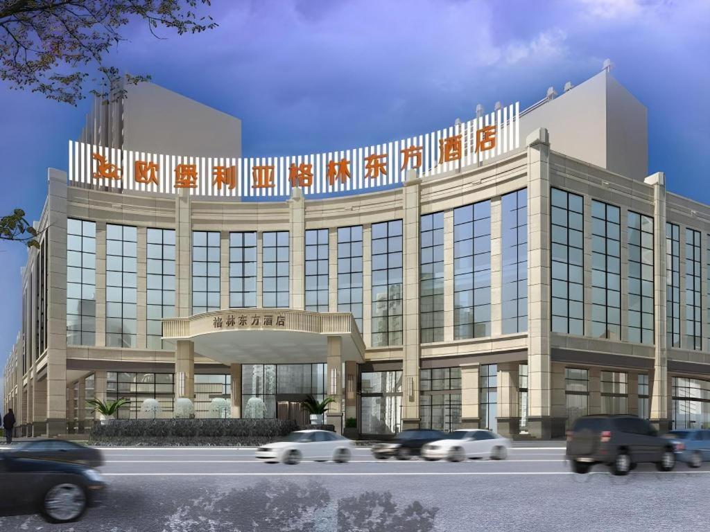 a rendering of a building with cars in front of it at GreenTree Eastern Yancheng Binhai County Aobaolia Beichen Hotel in Binhai