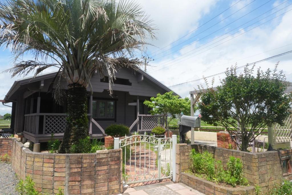 Un jardín fuera de 海まで車で3分!!木のぬくもりに癒されるログハウス,BBQ,サーフィン--Cute House Isumi--