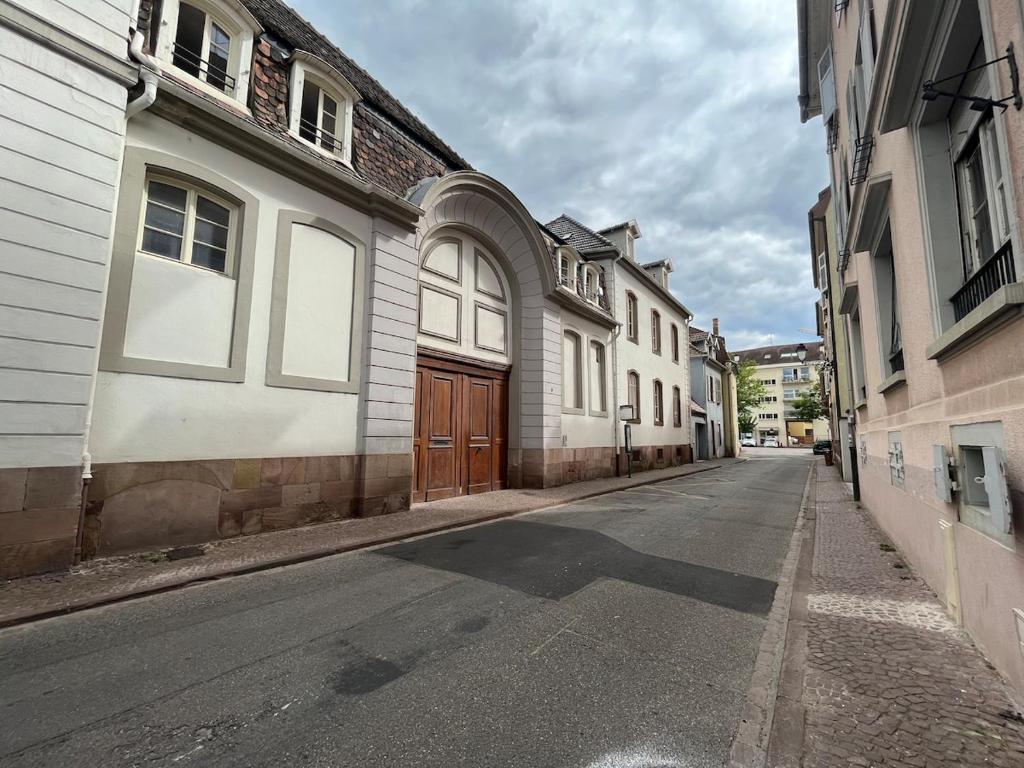 an empty street in a city with buildings at sainte anne petite venise colmar in Colmar