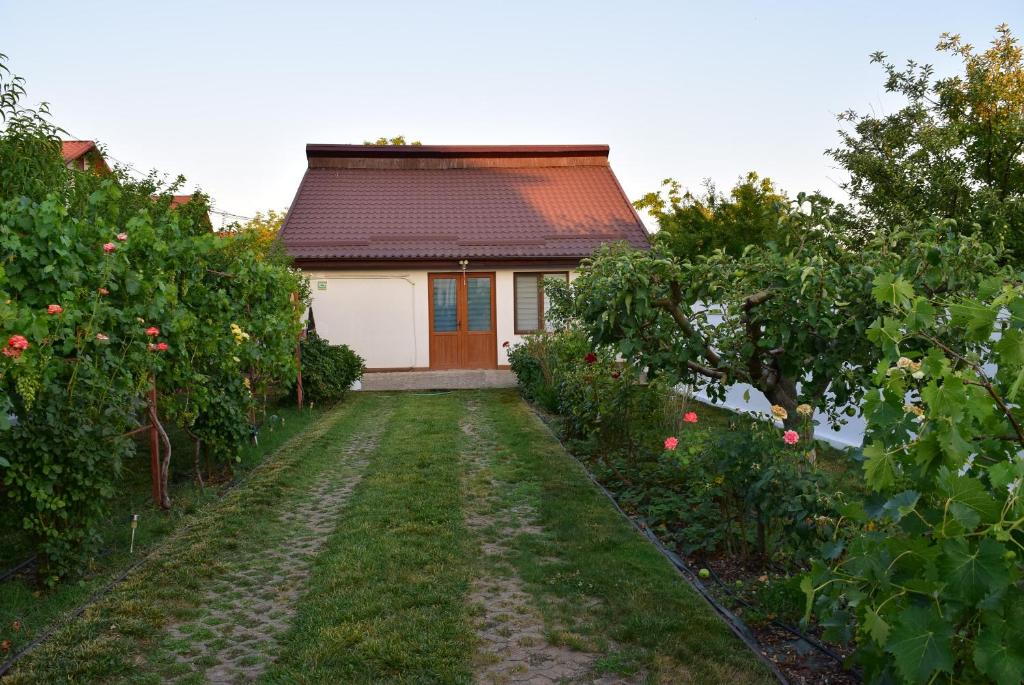 a house in the middle of an apple orchard at The Ranch House Bragadiru in Bragadiru
