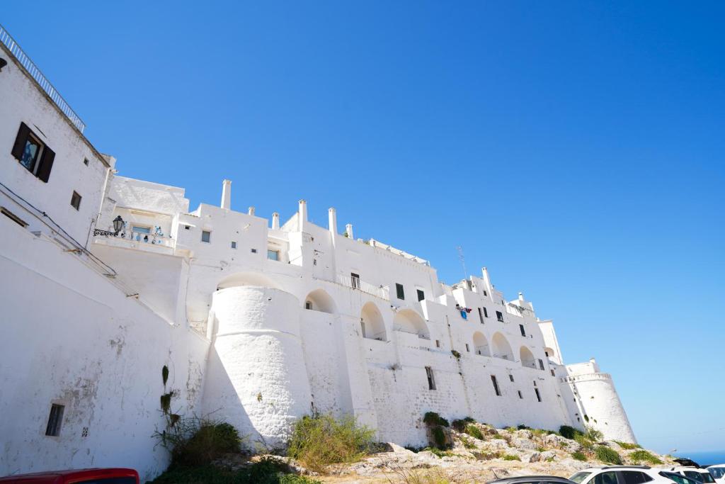 a white building on top of a hill at Casa Giglio in Ostuni