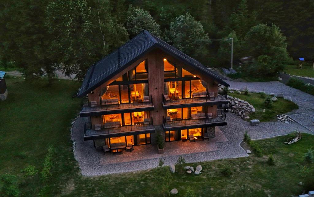 an overhead view of a large house with glass at Apartmány Dolina in Demanovska Dolina