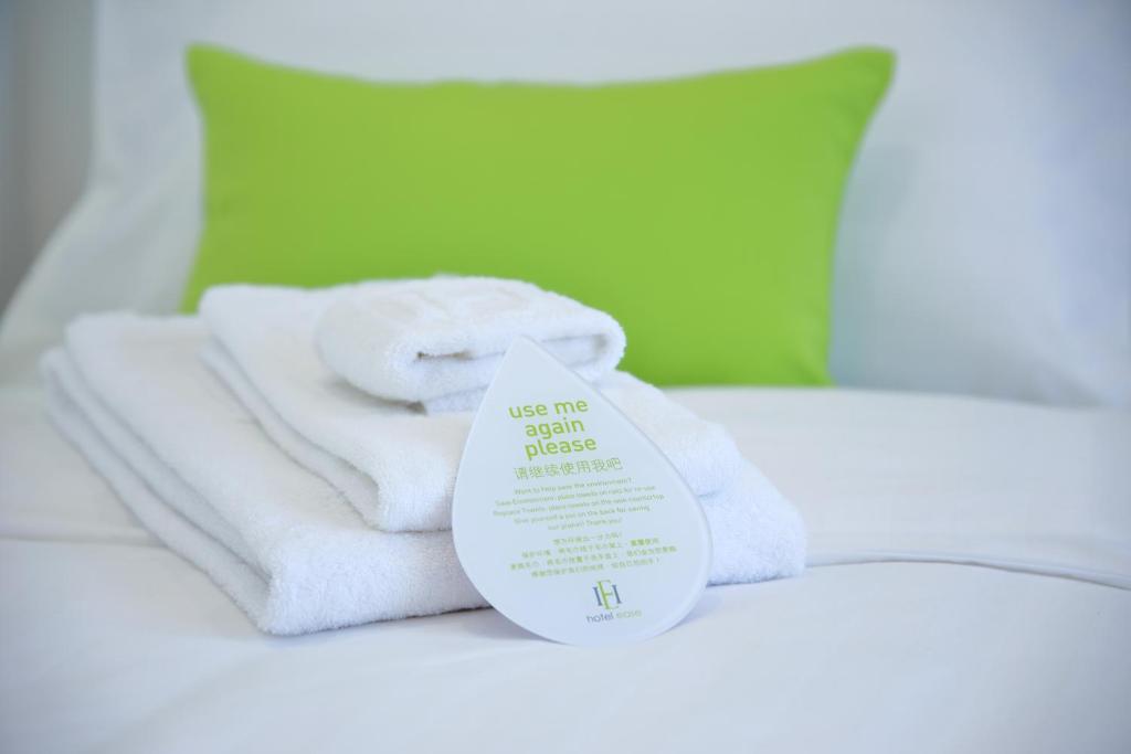 Postel nebo postele na pokoji v ubytování Hotel Ease Tsuen Wan
