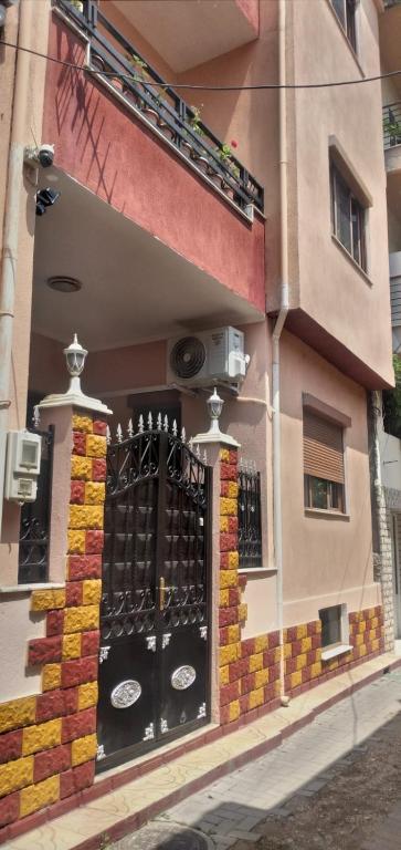 a building with a gate on the side of it at Vila Elio in Pogradec
