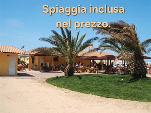 a picture of a resort with palm trees and a beach at Hotel Annarita-mezza pensione plus- spiaggia inclusa in Rimini