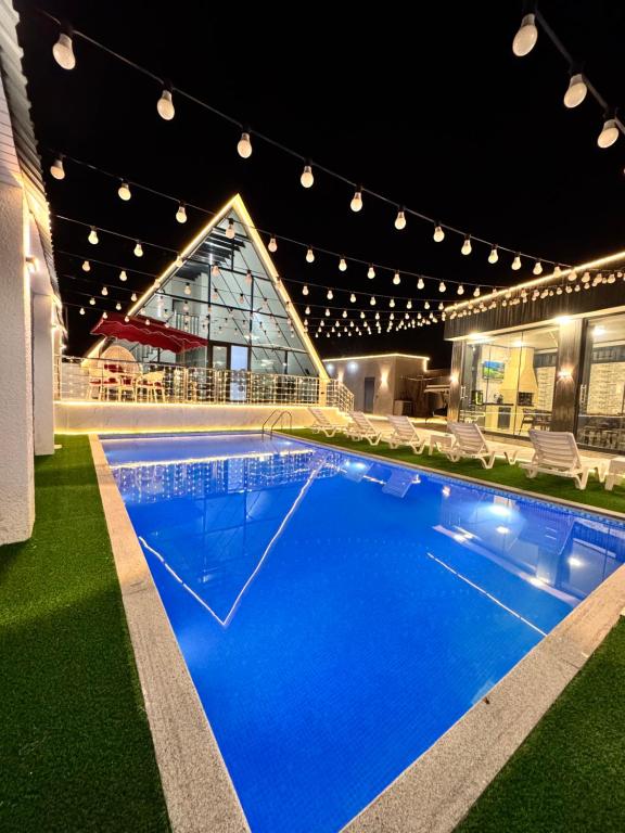 a large swimming pool in the middle of a building at AFrame Gabala Azerbaijan FF in Gabala
