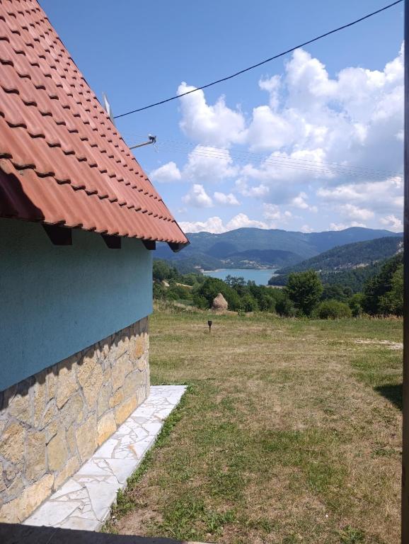a view from the side of a house with a red roof at Vila Suza-Vikendice i apartmani Jezdić in Jezdići