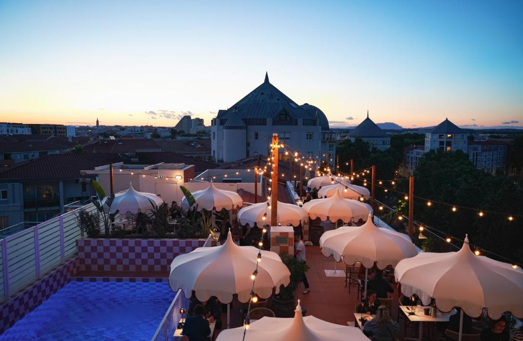 a group of white umbrellas on a roof at Miranove in Montpellier