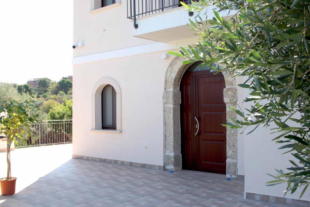 a building with a brown door on the side of it at Agriturismo Casarancio in Corriolo