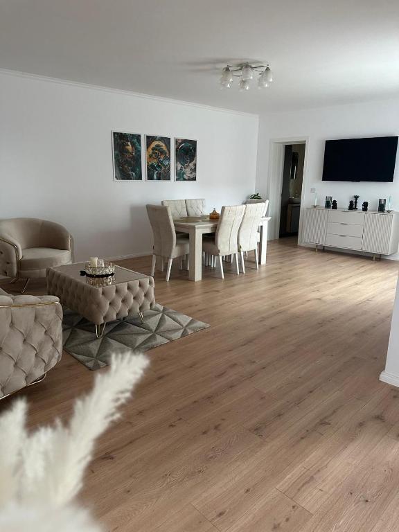 a living room with a couch and a table at Casa crisan in Mintiu Gherlii