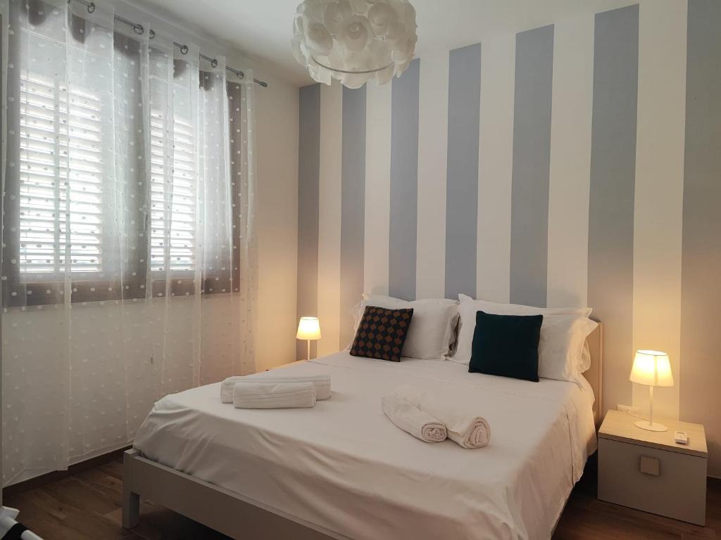 Una cama o camas en una habitación de I Leoni di Sicilia - Favignana