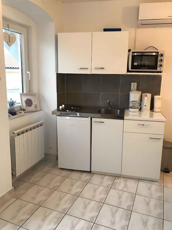 Kuchyňa alebo kuchynka v ubytovaní Apartments in Crikvenica 41045