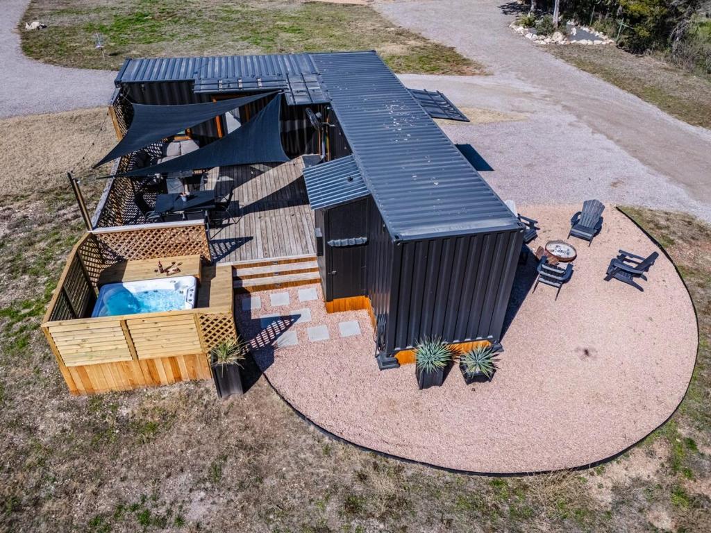 an overhead view of a house with a swimming pool at Contained In Gruene -River Edition- Hot Tub in New Braunfels