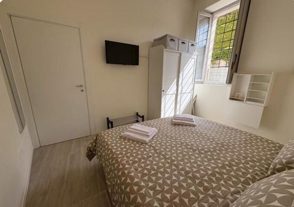 Postel nebo postele na pokoji v ubytování Arte, Business e Relax nel cuore di Piacenza