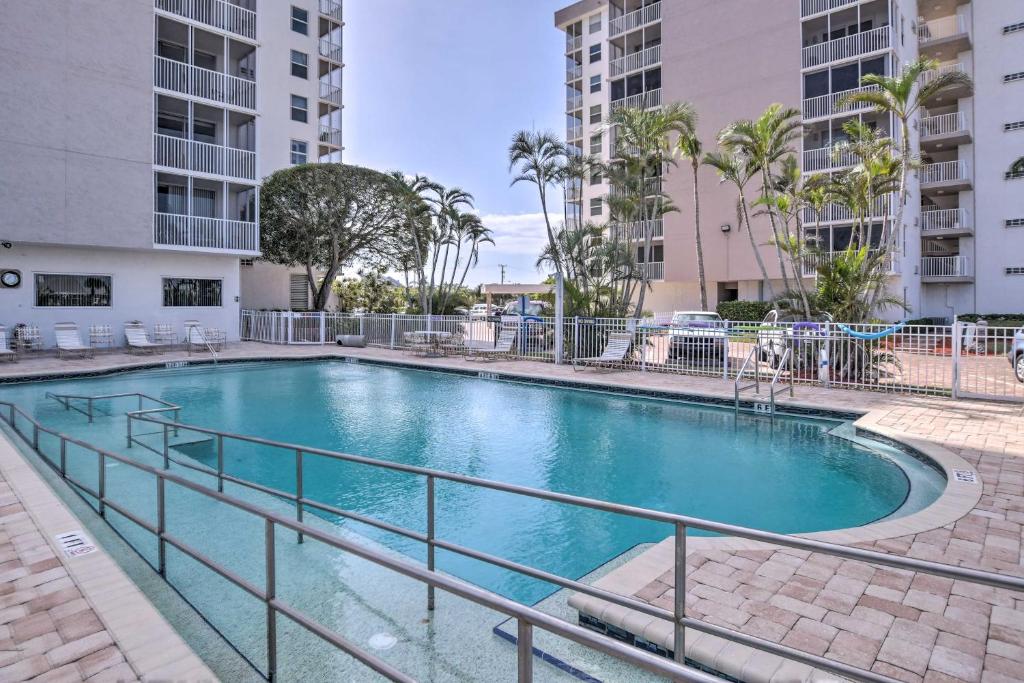 a swimming pool in the middle of a building at Walk to Public Beach Access Bonita Springs Gem! in Bonita Springs