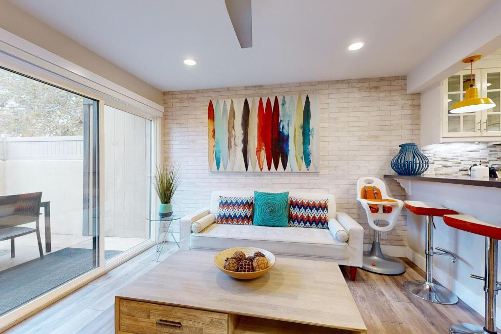a living room with a couch and a table at On the Doorstep in Anaheim