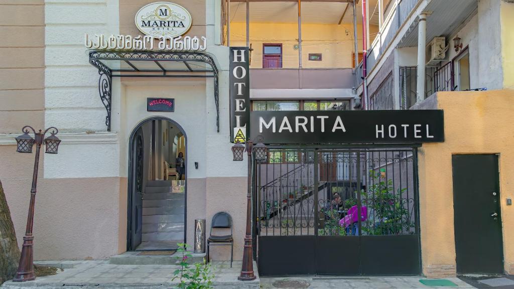 a sign for a mariata hotel on a building at Marita Hotel in Tbilisi City