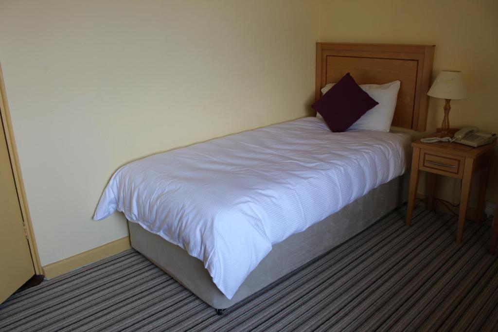 Postel nebo postele na pokoji v ubytování Achill Sound Hotel - Ostan Ghob A'Choire