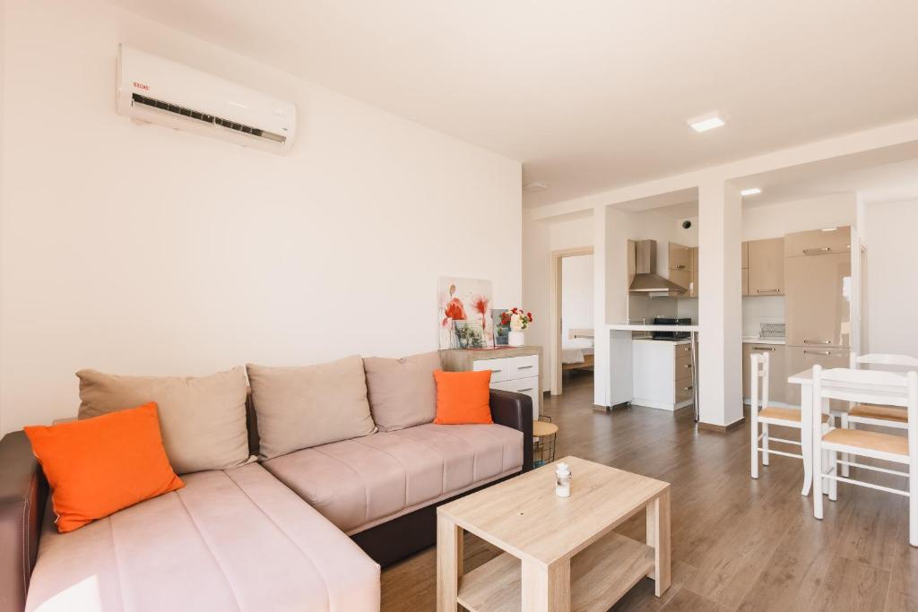 a living room with a couch and a table at Apartment L'ideal in Ulcinj