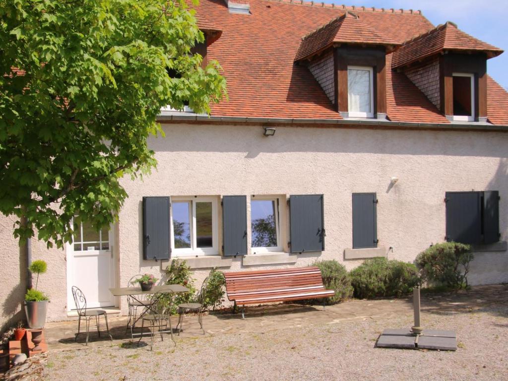 a house with a bench in front of it at Gîte cosy avec terrasse et WiFi - 2 ch, 4 pers à Besson - FR-1-489-355 in Besson