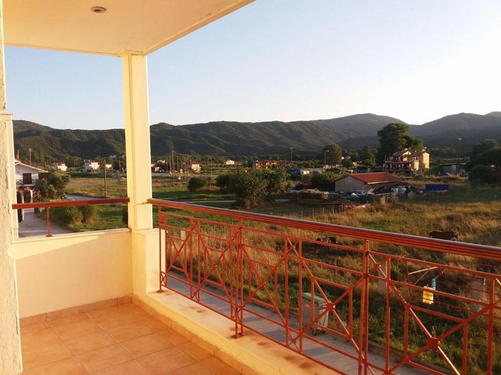 a balcony with a view of the mountains at Hotel Kosmas in Sarti