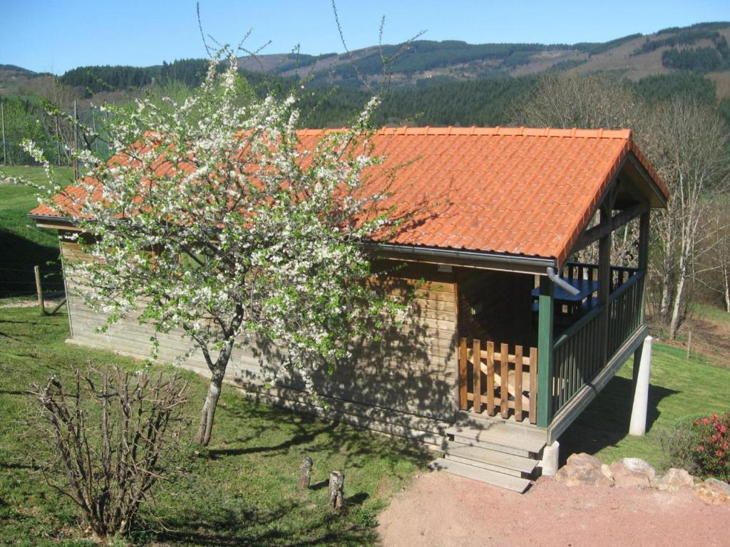 a small building with an orange roof and a tree at Chalet familial 35m² aux Monts de la Madeleine avec terrasse, animaux acceptés - FR-1-496-240 in Saint-Rirand