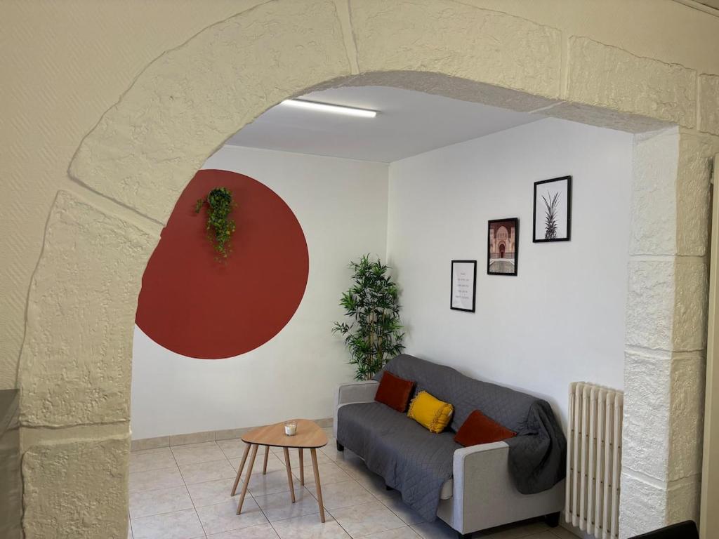 a living room with a couch and a table at La Casa Mexico - Terrasse & Parking privé in Trignac