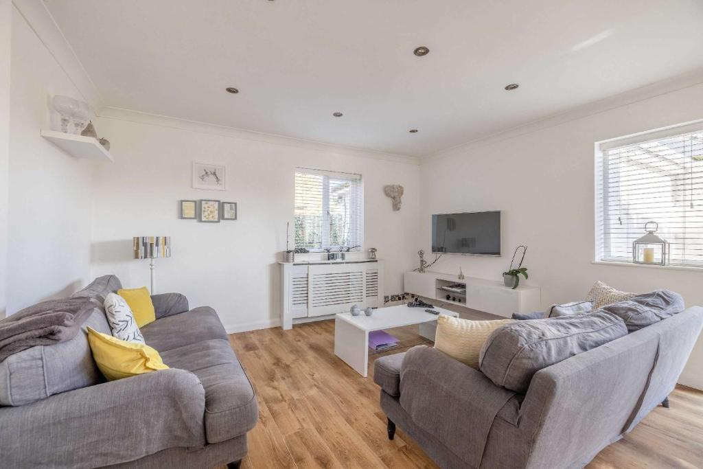a living room with two couches and a tv at Host & Stay - Meadow Way in Windsor