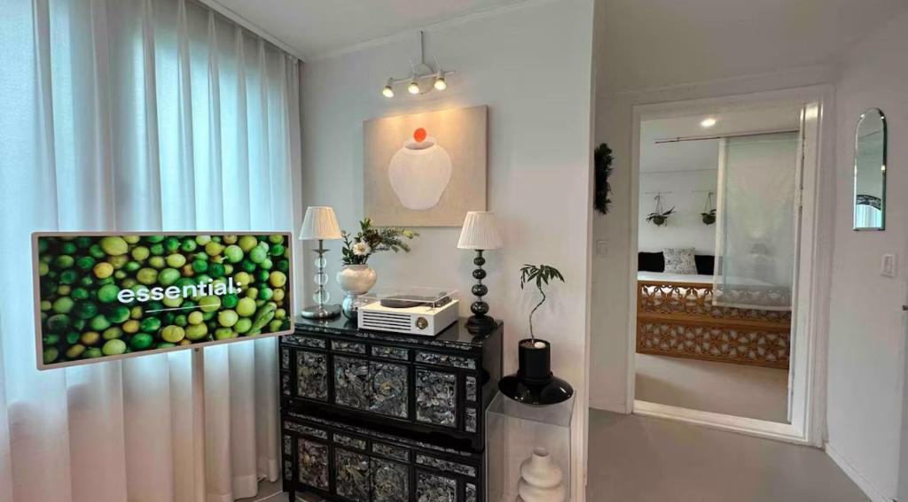 a room with a table with a television and a window at Secret Villa Seoul , Korean Traditional and morden mix Design in Seoul