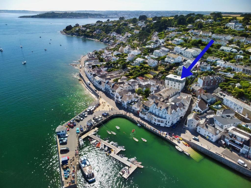 an aerial view of a city with a harbor at Pennant in Saint Mawes