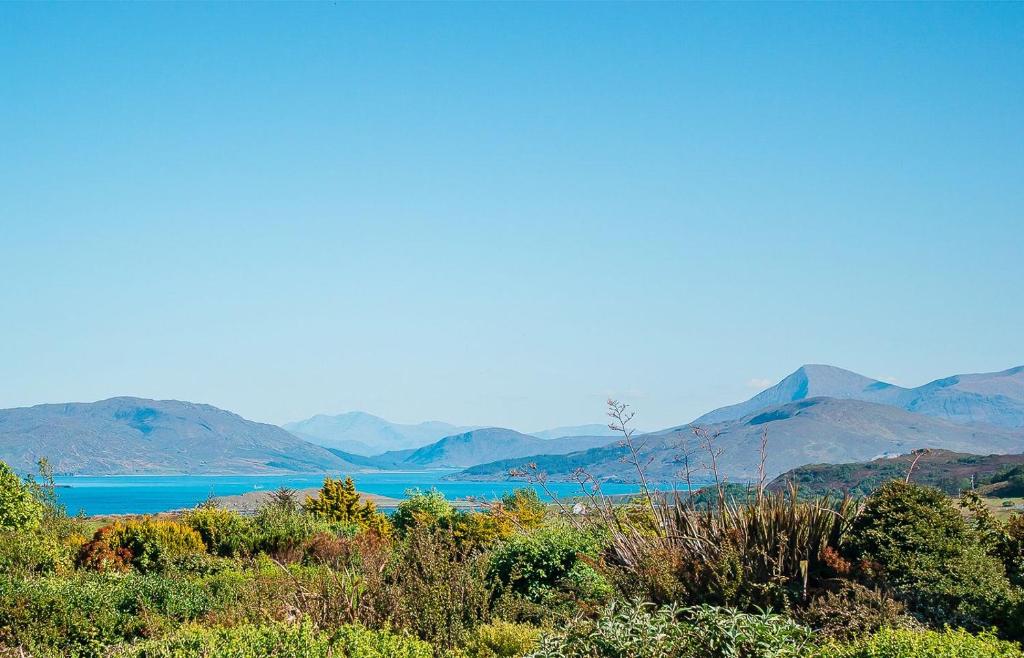 a view of a lake with mountains in the background at Creag Dubh in Camastianavaig