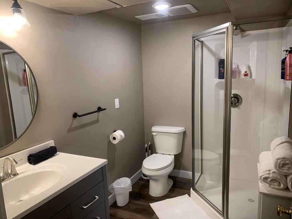 a bathroom with a shower and a toilet and a sink at No Cleaning Fee BYU Creamery WD 65 TV King in Provo