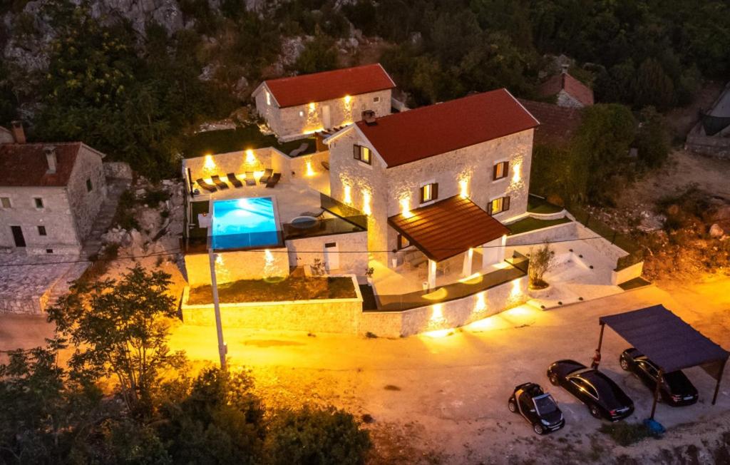 an aerial view of a house with cars parked in a driveway at Villa Marina Neretva by Villas Guide in Metković