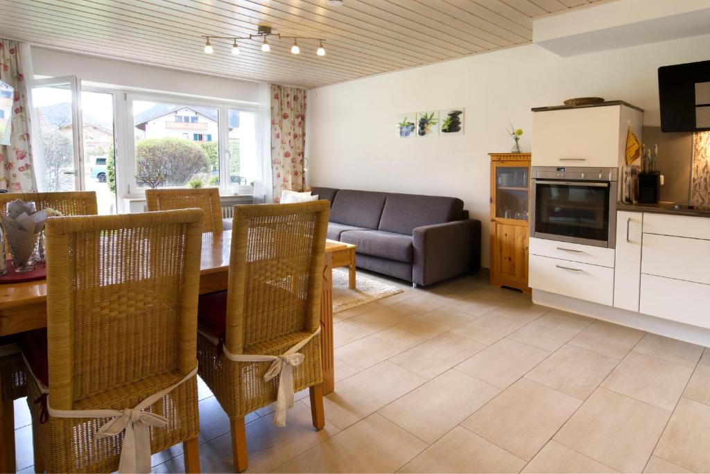 a living room with a table and a couch at Sophie -203- in Mittenwald