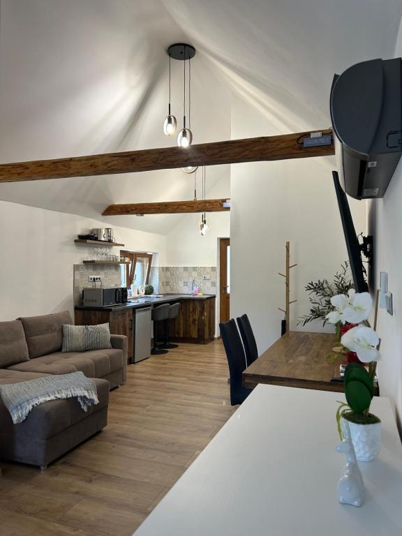 a living room with a couch and a table at Somló Éden in Somlószőlős
