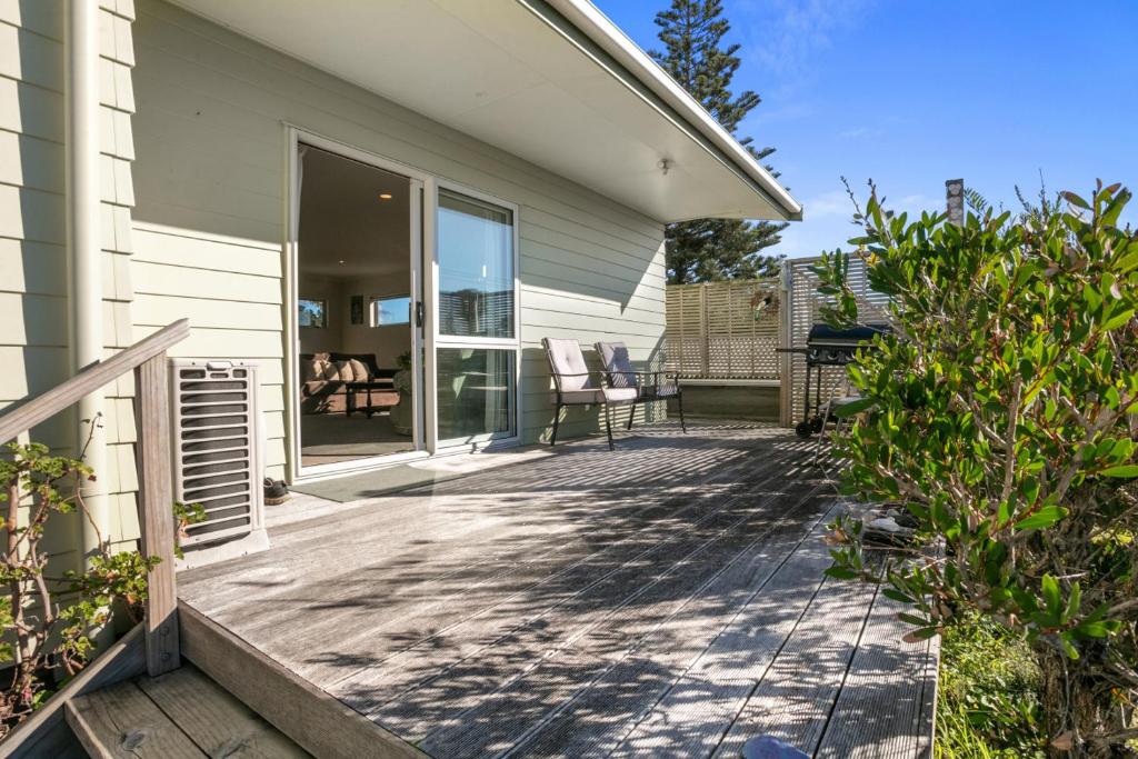 a porch of a house with a patio at Golden Dawn in Waihi Beach