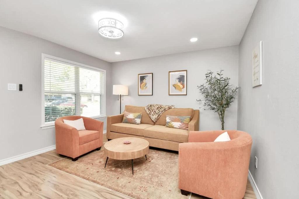 a living room with a couch and two chairs at Cozy Houston Haven-Near Downtown & NRG in Houston